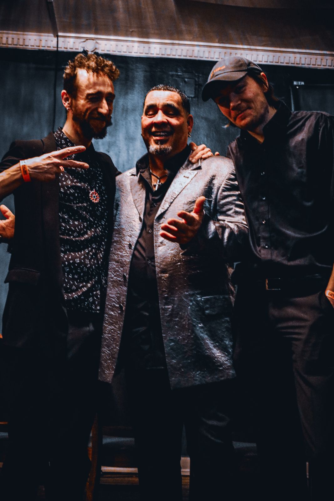JonnyLuis with two bandmates backstage