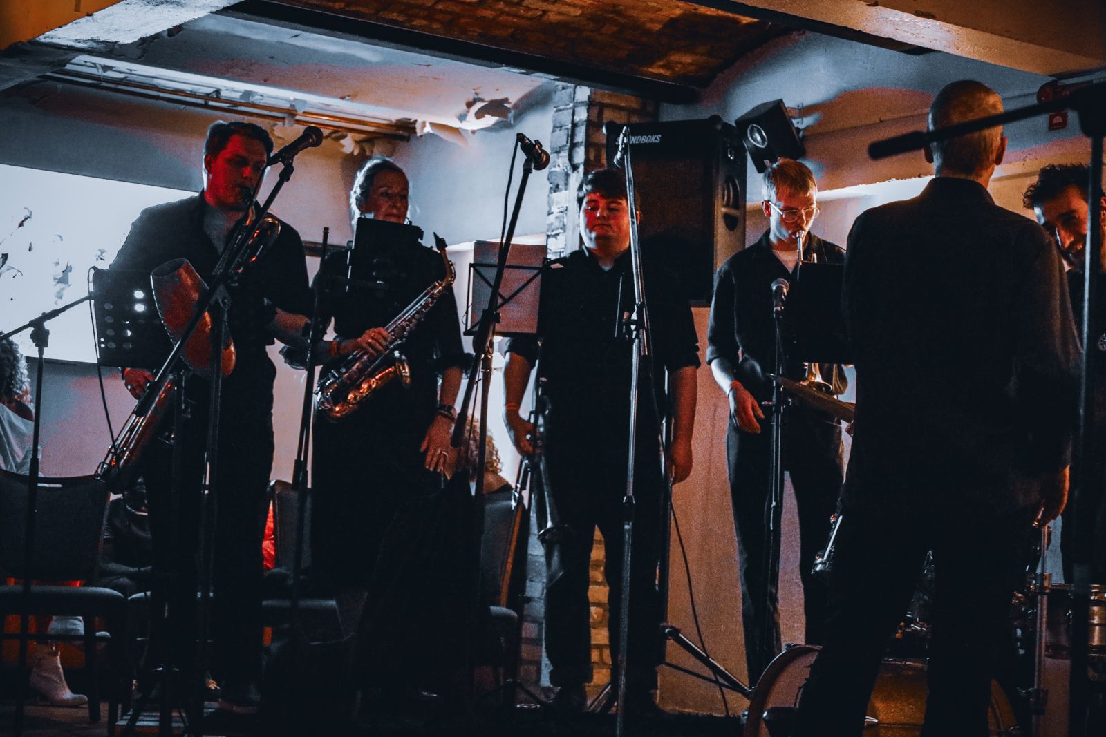 Horn section playing live